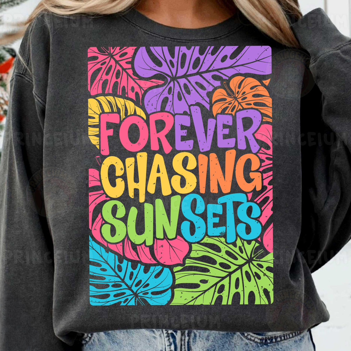 a woman wearing a sweatshirt that says forever chasing sun sets