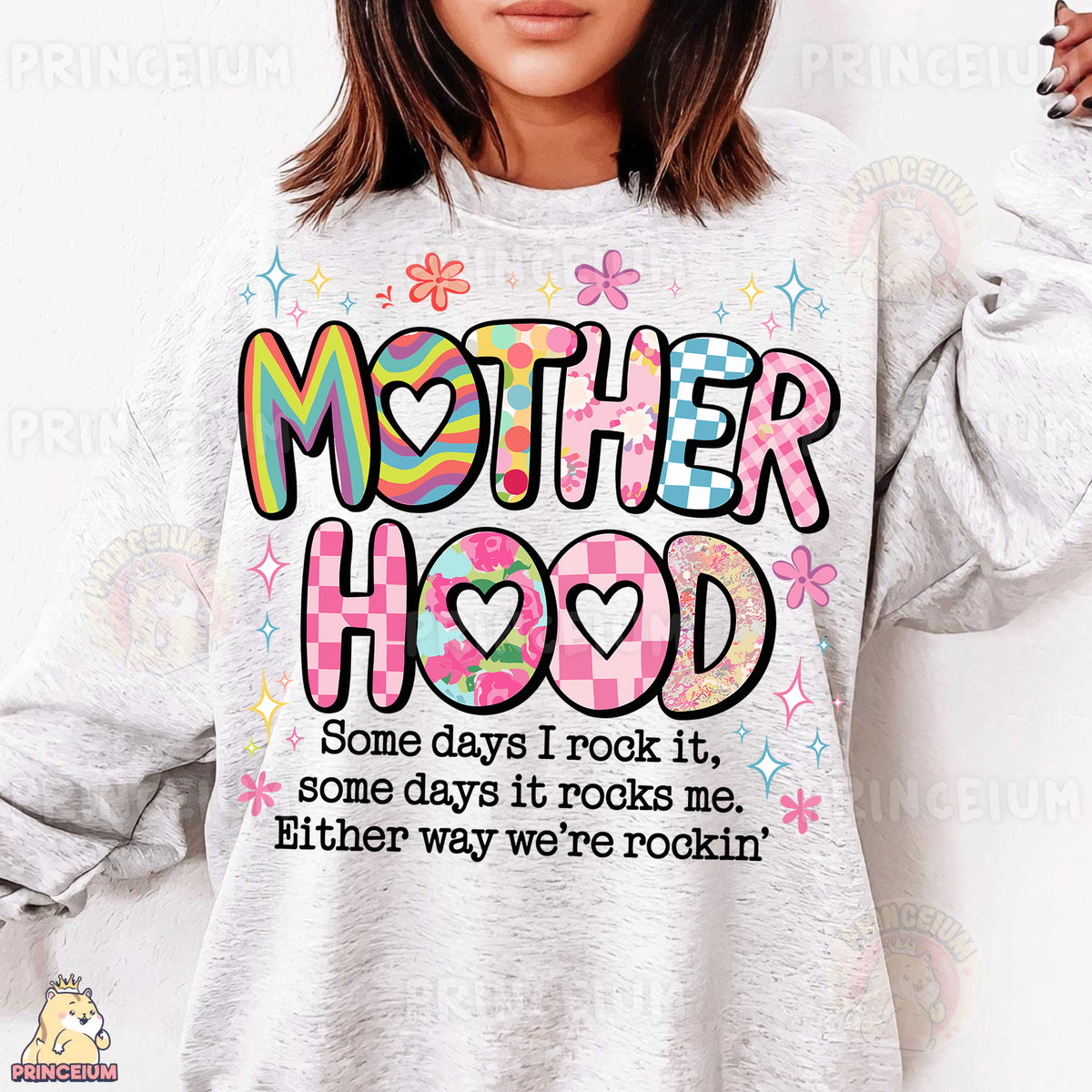 a woman wearing a sweatshirt that says motherhood