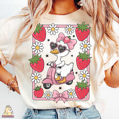 a woman wearing a t - shirt with a picture of a duck on a sc