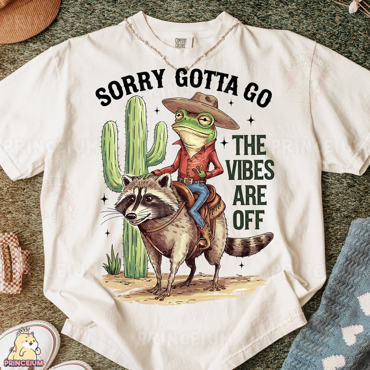 a t - shirt with a racoon riding a racoon on it
