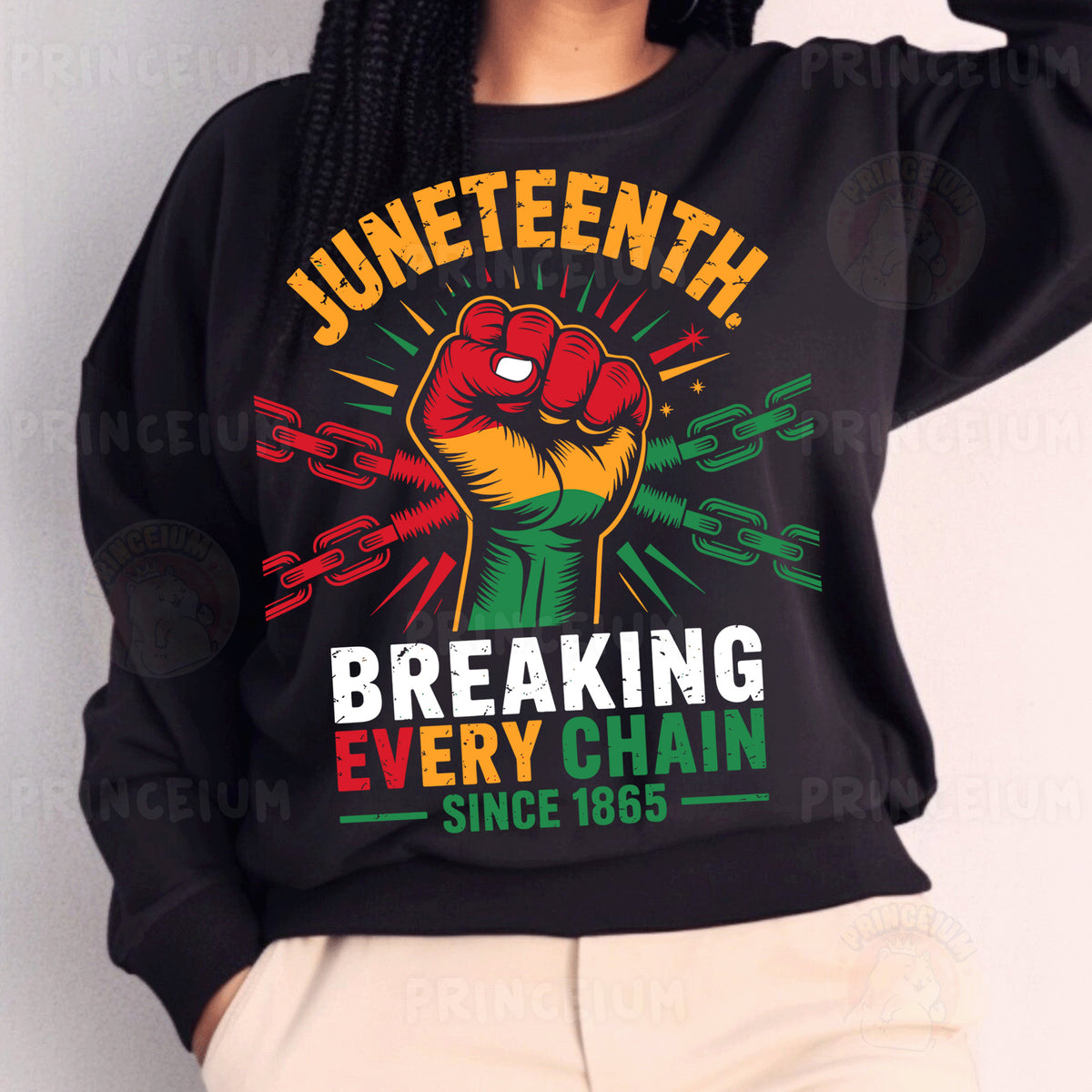 a woman wearing a black sweatshirt with a fist on it