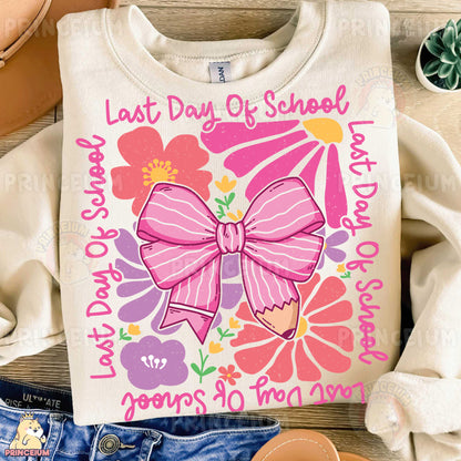 a white shirt with a pink bow on it