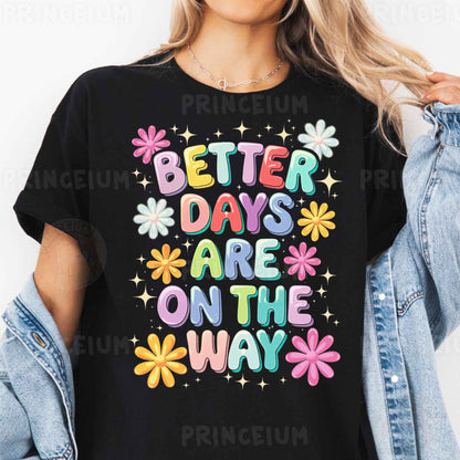 a woman wearing a black t - shirt that says better days are on the way