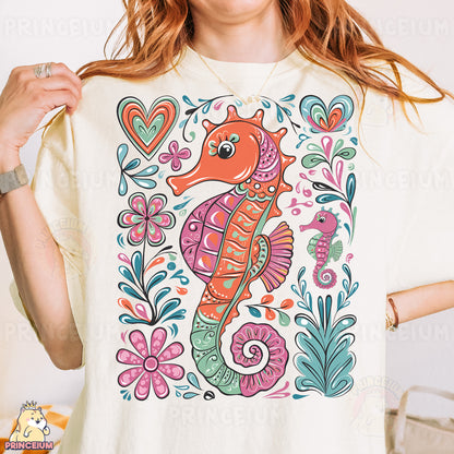 a woman wearing a t - shirt with a sea horse on it