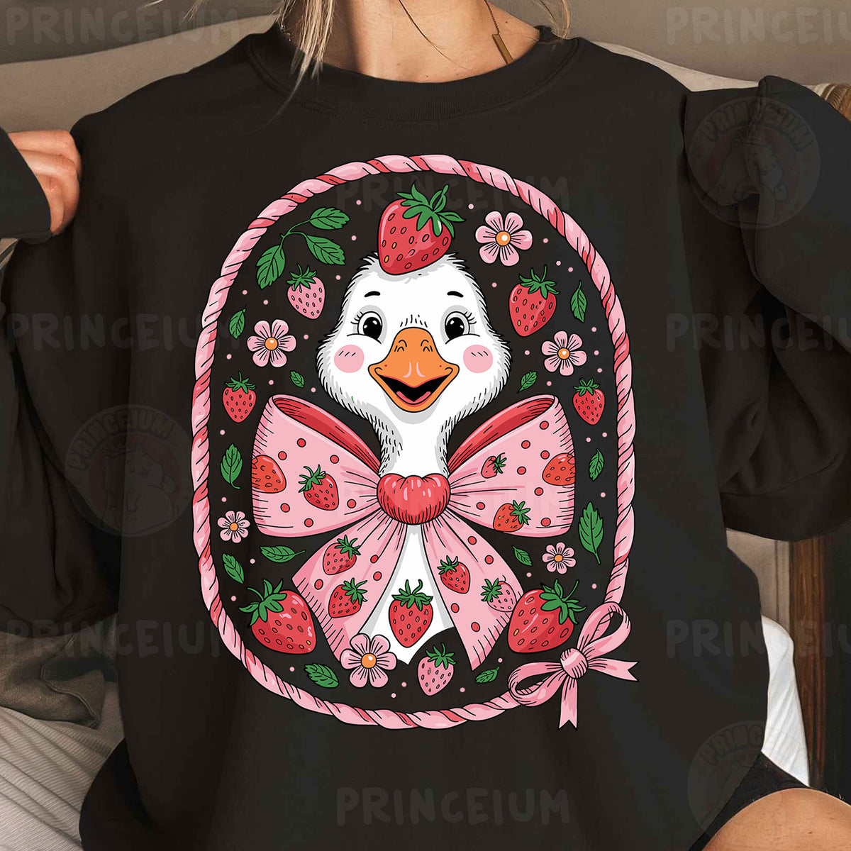 a woman wearing a black shirt with a picture of a duck wearing a pink bow