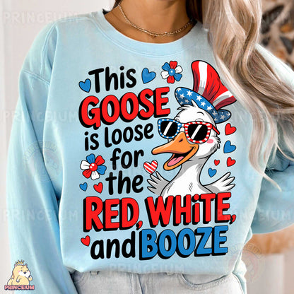 a woman wearing a blue sweater with a white duck wearing a red, white and