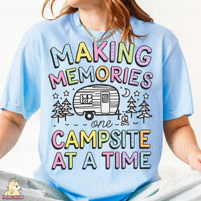 a woman wearing a blue shirt that says making memories one campsite at a time