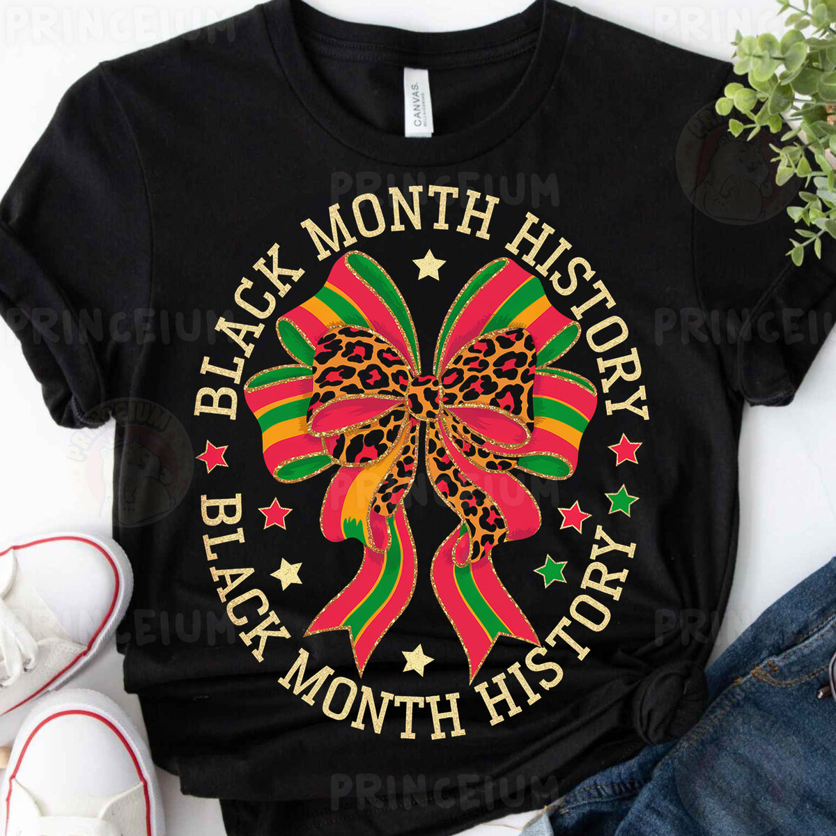 a black t - shirt with a red, green, and yellow bow on it
