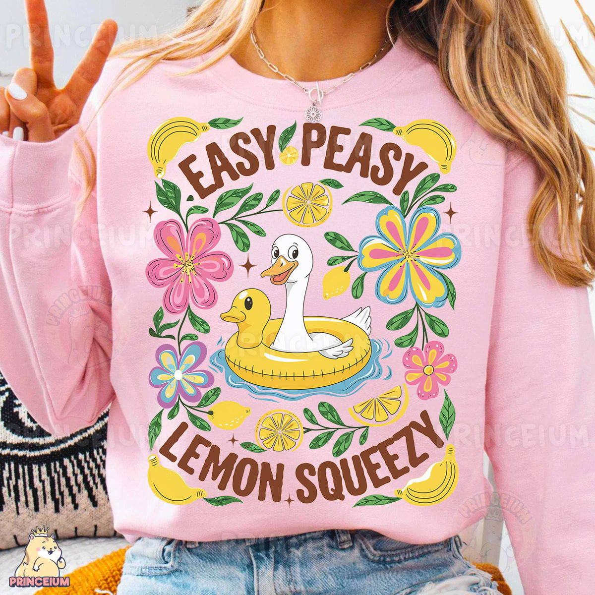 a woman wearing a pink sweatshirt that says easy peasy lemon squeezey