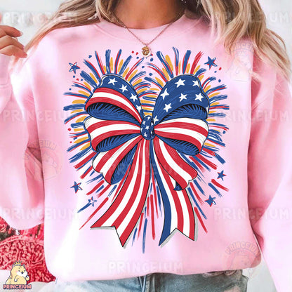 a woman wearing a pink sweatshirt with an american flag bow on it