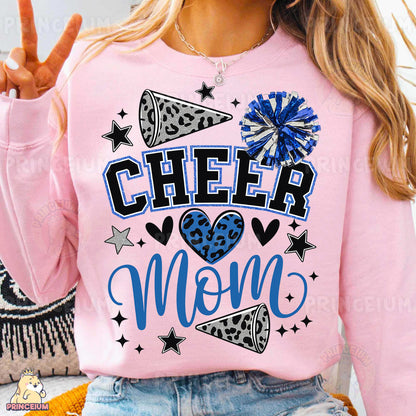 a woman wearing a pink cheer mom shirt
