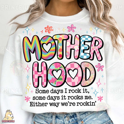 a woman wearing a sweatshirt that says motherhood