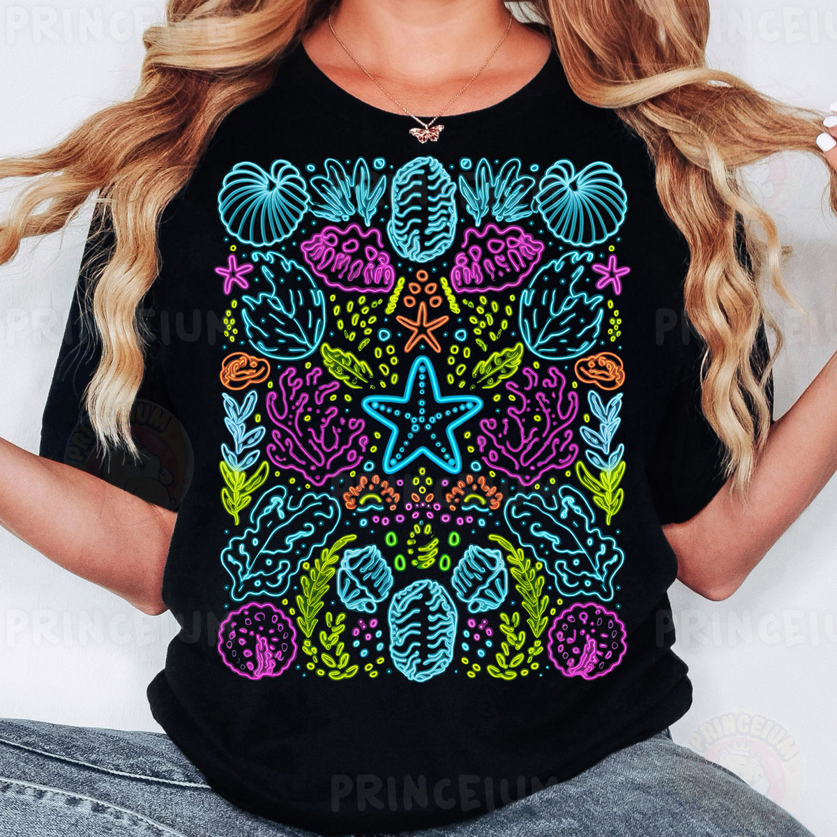a woman wearing a black t - shirt with a colorful design on it