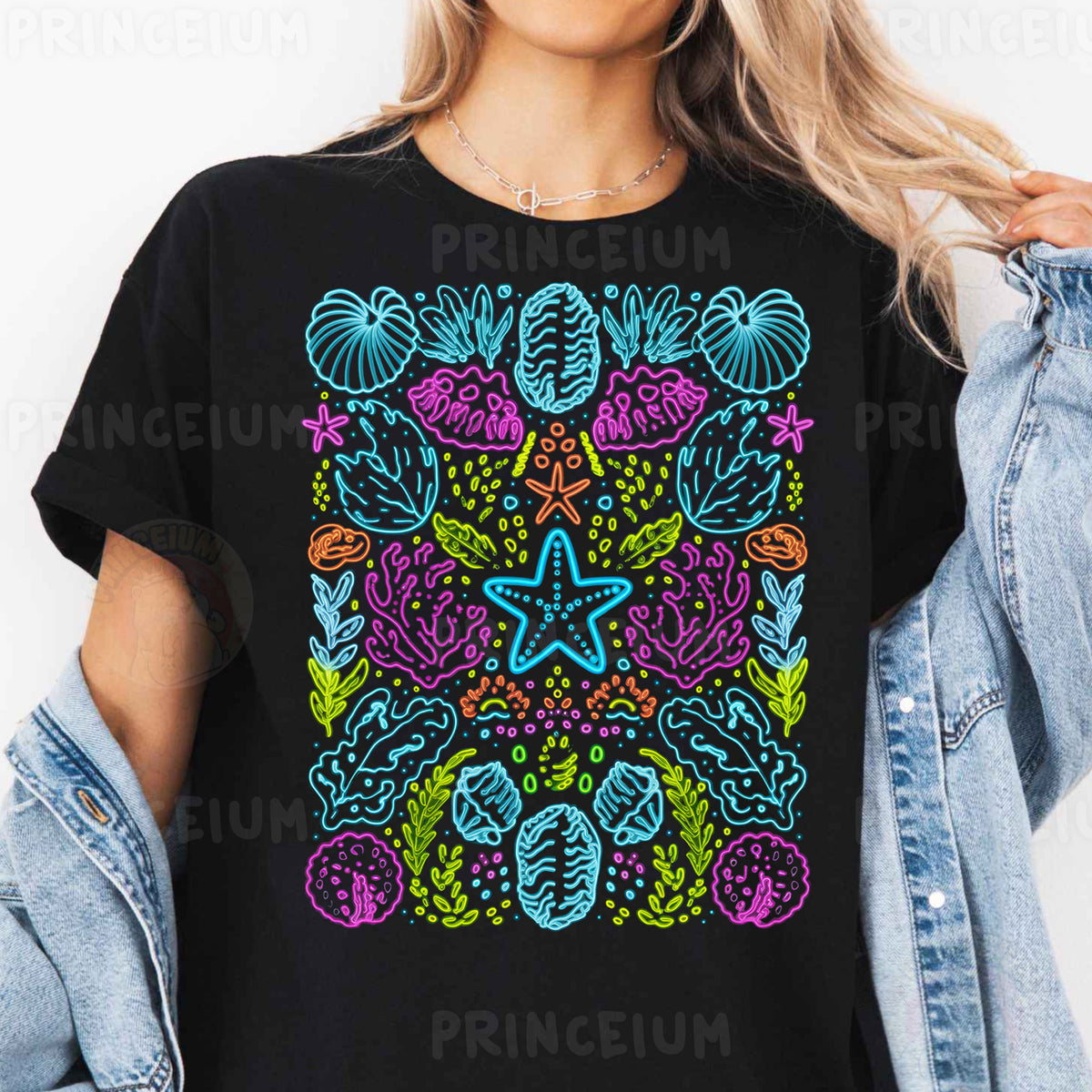 a woman wearing a black t - shirt with a colorful design