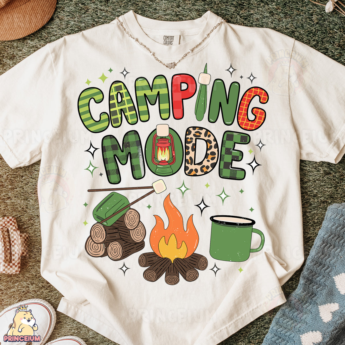 a t - shirt that says camping mode next to a pair of shoes