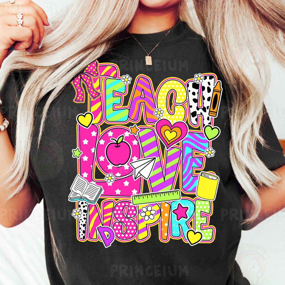 a woman wearing a t - shirt that says teach love inspire