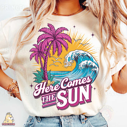a woman wearing a t - shirt that says here comes the sun