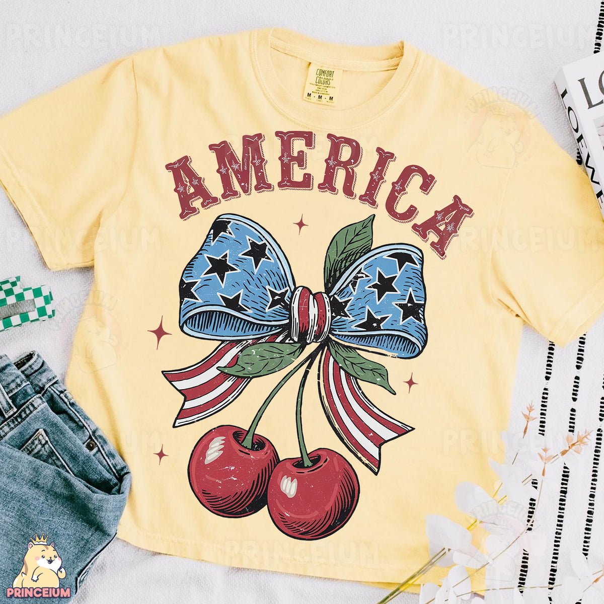a yellow shirt with an american flag bow and cherries