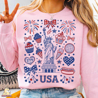 a woman wearing a pink sweatshirt with the statue of liberty on it