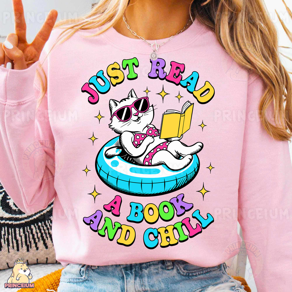 a woman wearing a pink shirt that says just read a book and chill