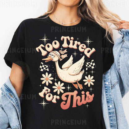 a woman wearing a black t - shirt with a white duck on it