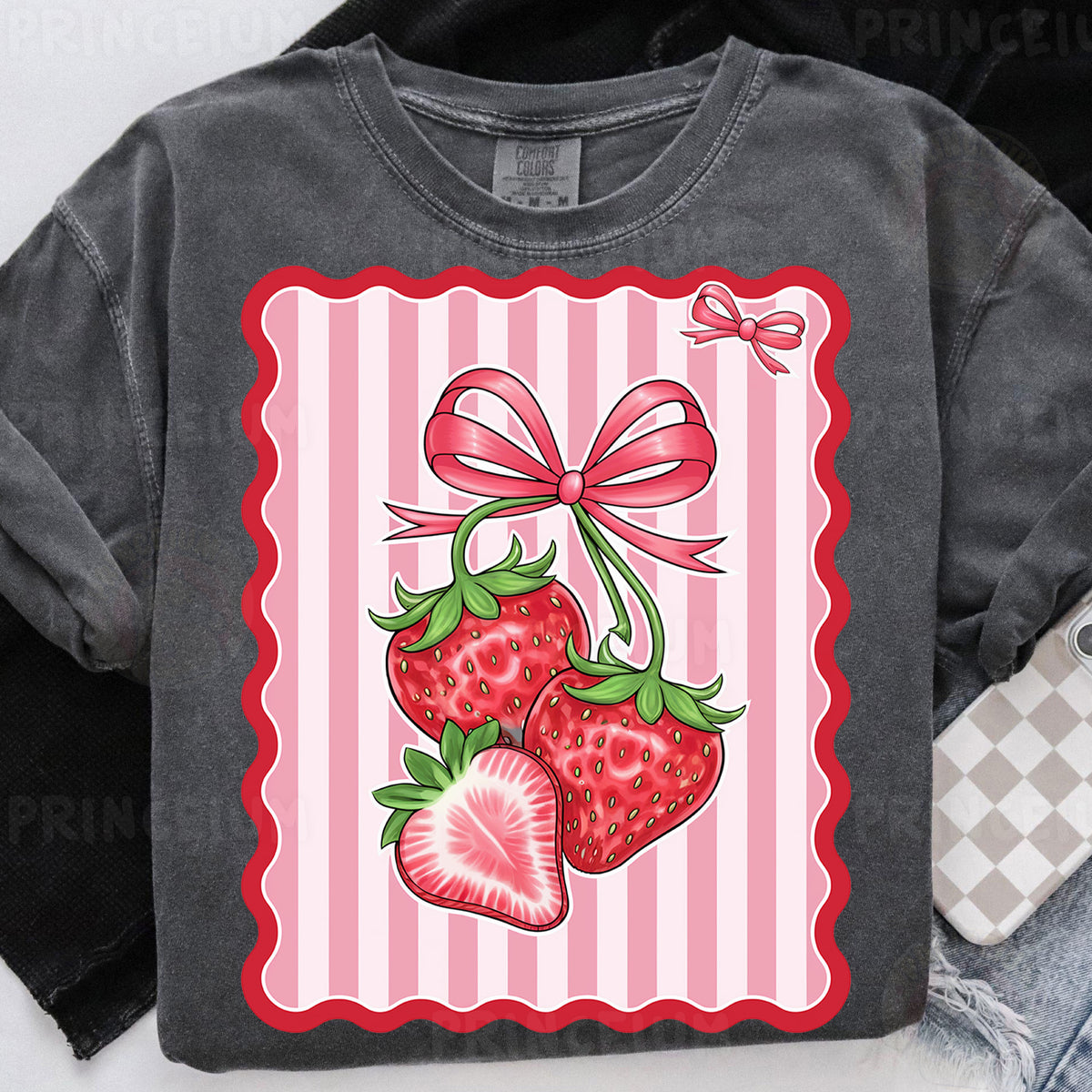 a t - shirt with a bow and two strawberries on it