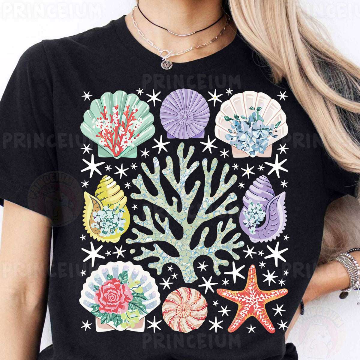 a woman wearing a black shirt with colorful seashells on it