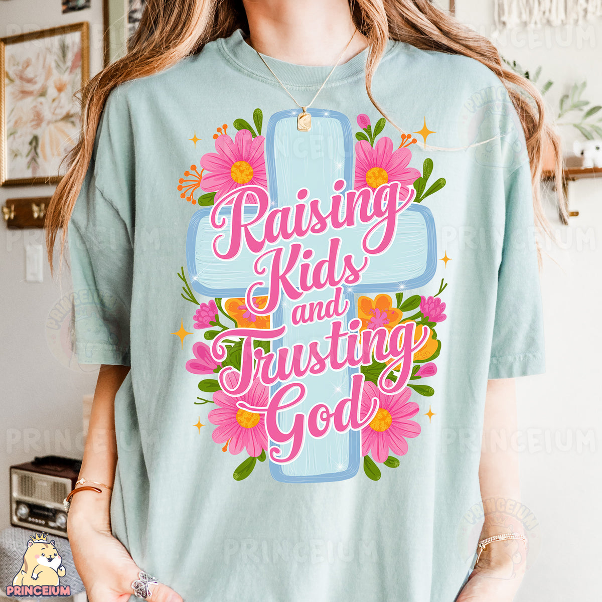 a woman wearing a t - shirt that says raising kids and trusting god