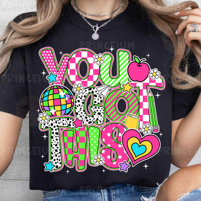 a woman wearing a t - shirt with the words you got this on it