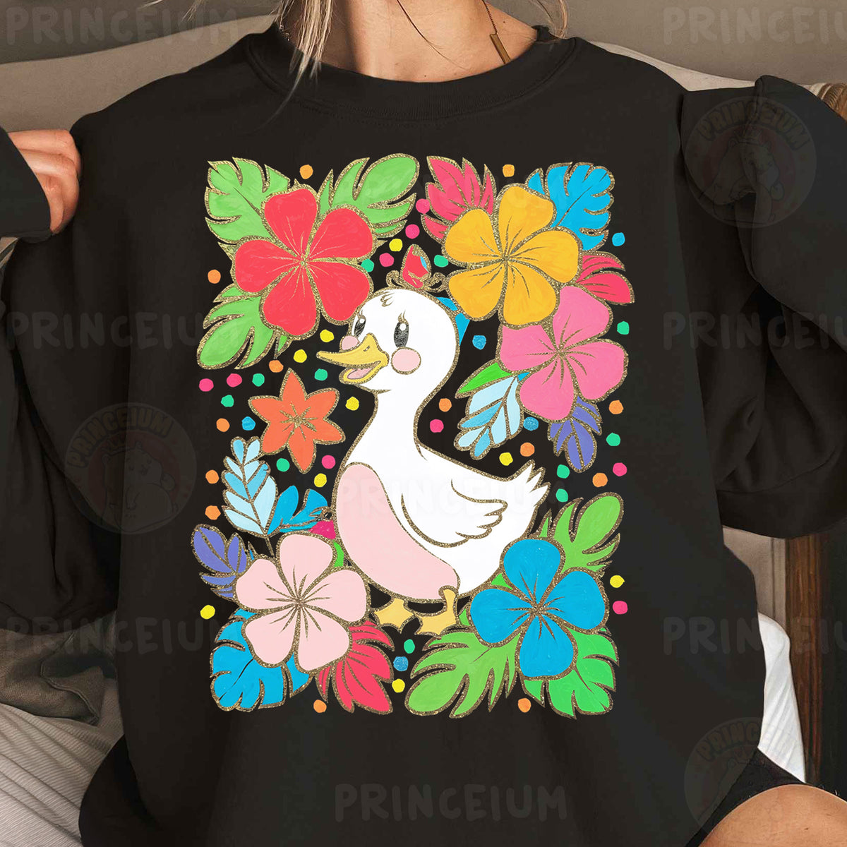 a woman wearing a black sweatshirt with a white duck surrounded by flowers