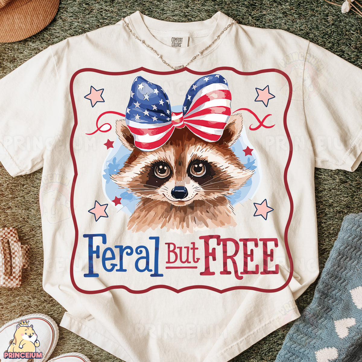 a t - shirt with a raccoon wearing an american flag bow
