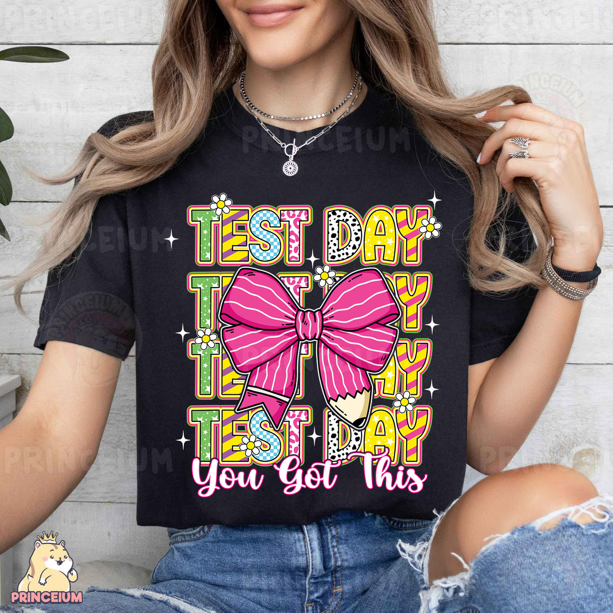 a woman wearing a black tshirt with a pink bow