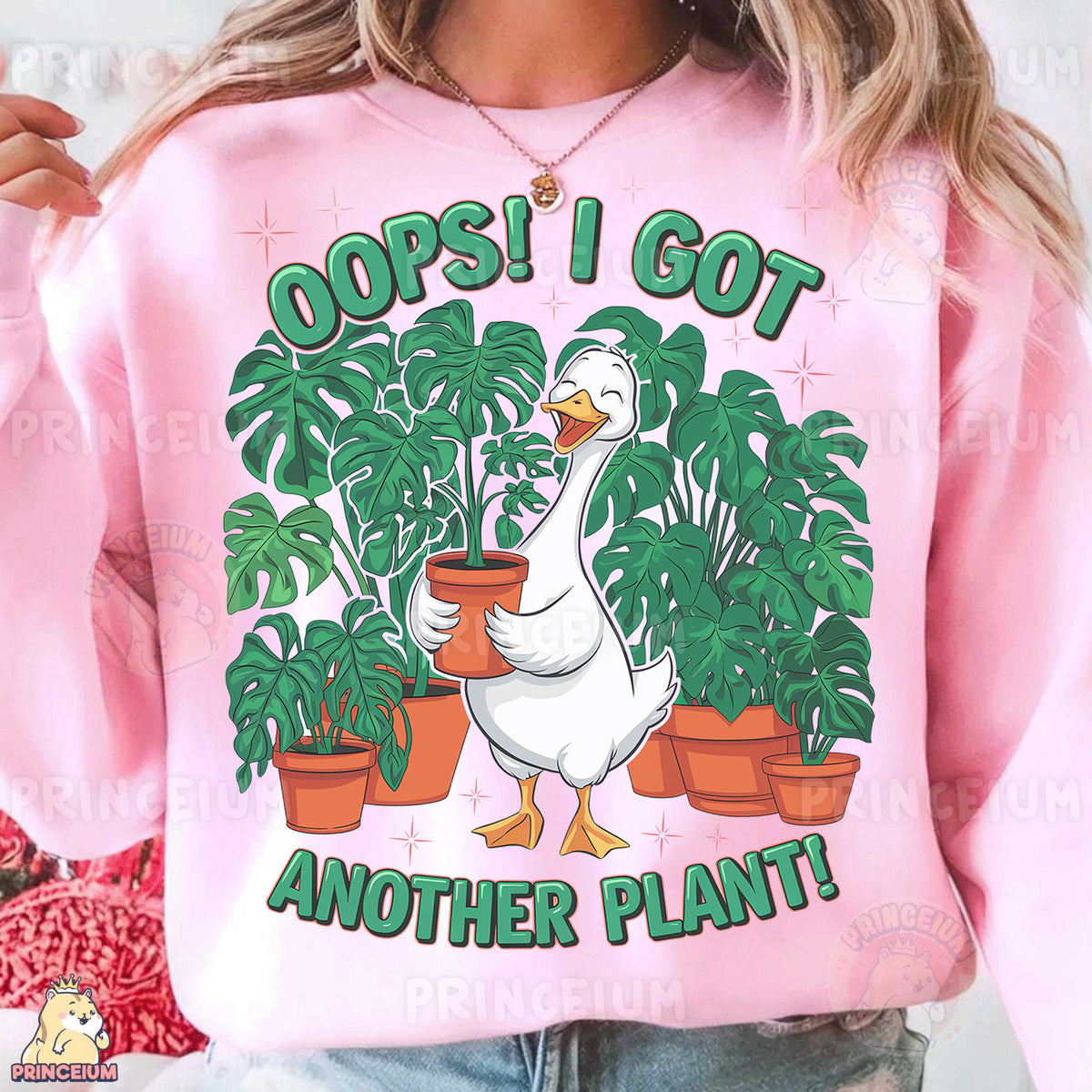 a woman wearing a pink sweatshirt with a goose holding a potted plant