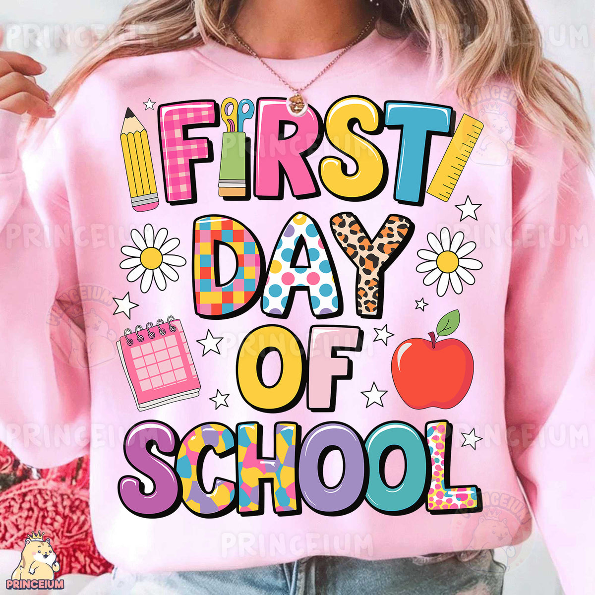 a woman wearing a pink sweatshirt that says first day of school