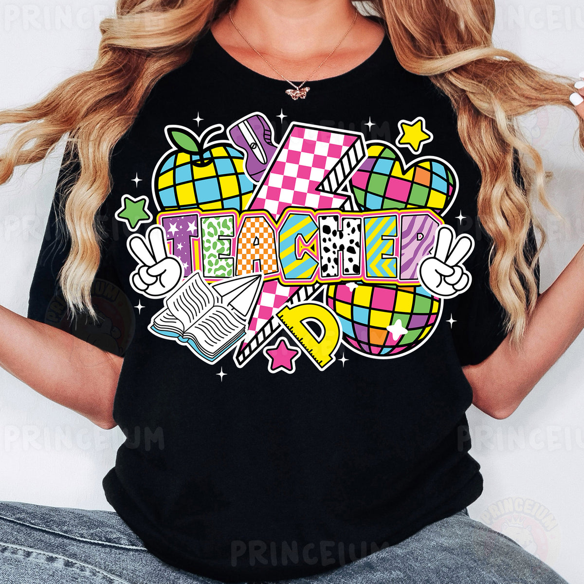 a woman wearing a black t - shirt with a colorful graphic design