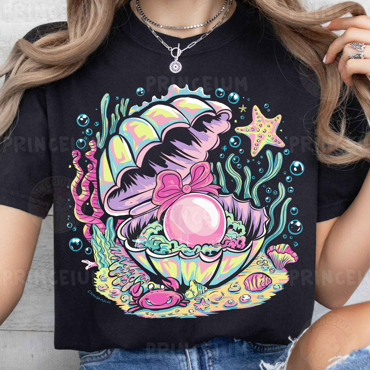 a woman wearing a t - shirt with an image of a mermaid on it