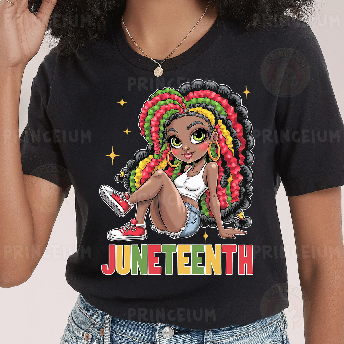 a woman wearing a black t - shirt with a picture of a girl with a