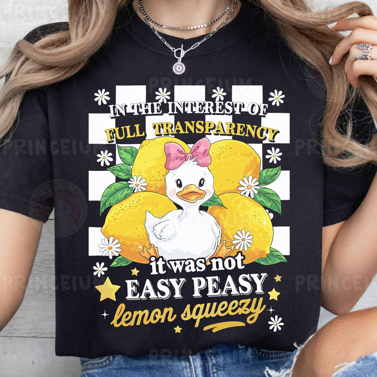 a woman wearing a black t - shirt with an image of a chicken on it