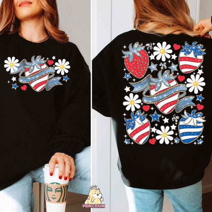 a woman wearing a black sweatshirt with american flags and flowers on it