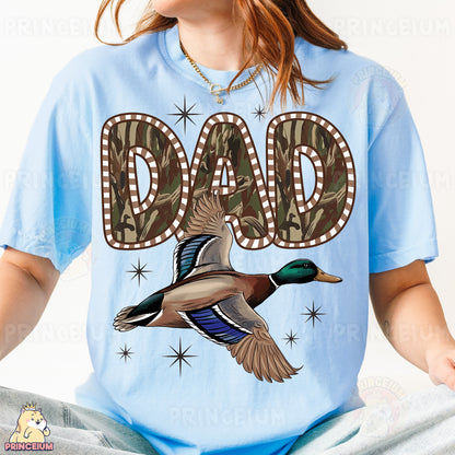 a woman wearing a blue shirt with a duck on it