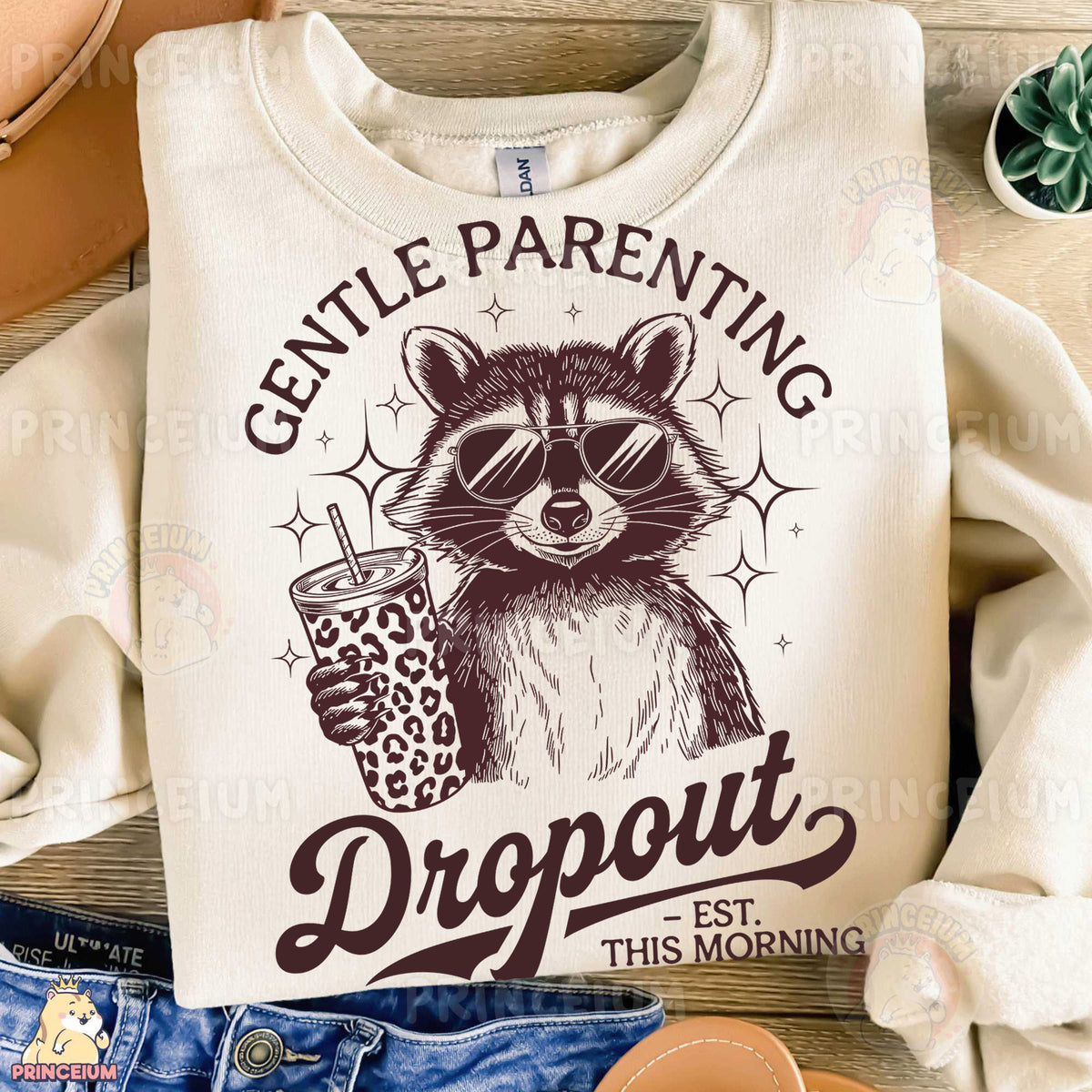 a white shirt with a raccoon holding a drink