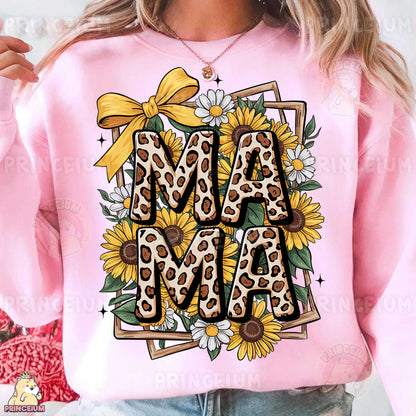a woman wearing a pink sweatshirt with sunflowers on it