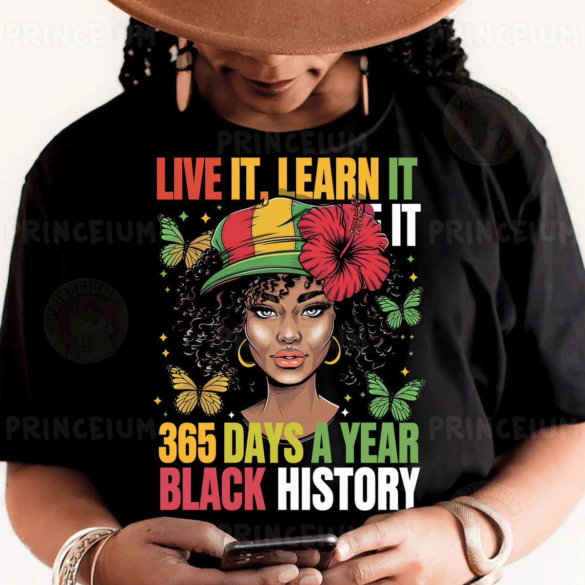a woman wearing a black t - shirt with a black history design on it