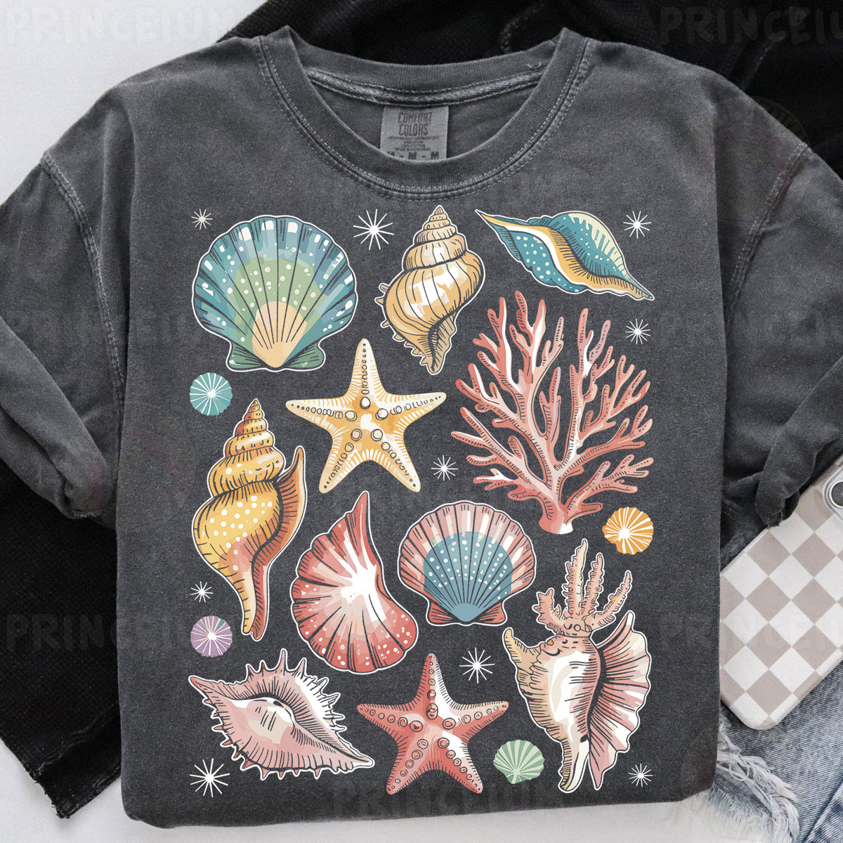 a t - shirt with a bunch of seashells on it