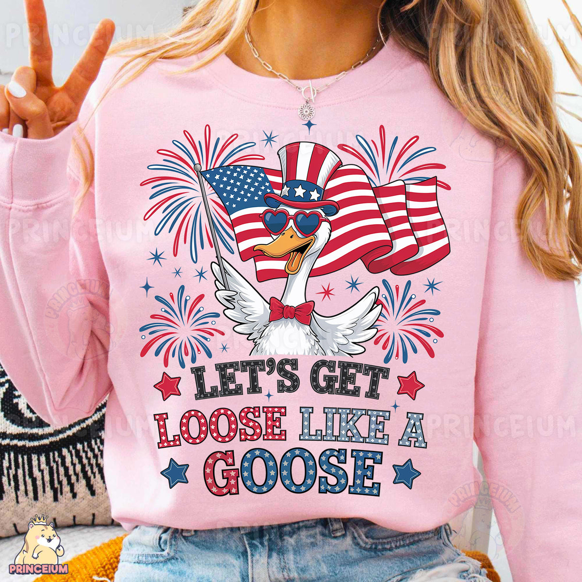 a woman wearing a pink sweatshirt with an american flag on it