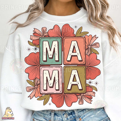 a woman wearing a white sweatshirt with the word mama printed on it