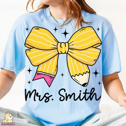 a girl wearing a blue shirt with a yellow bow on it