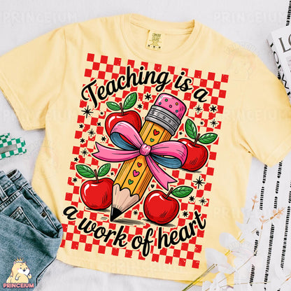 a t - shirt with a pencil and apple on it