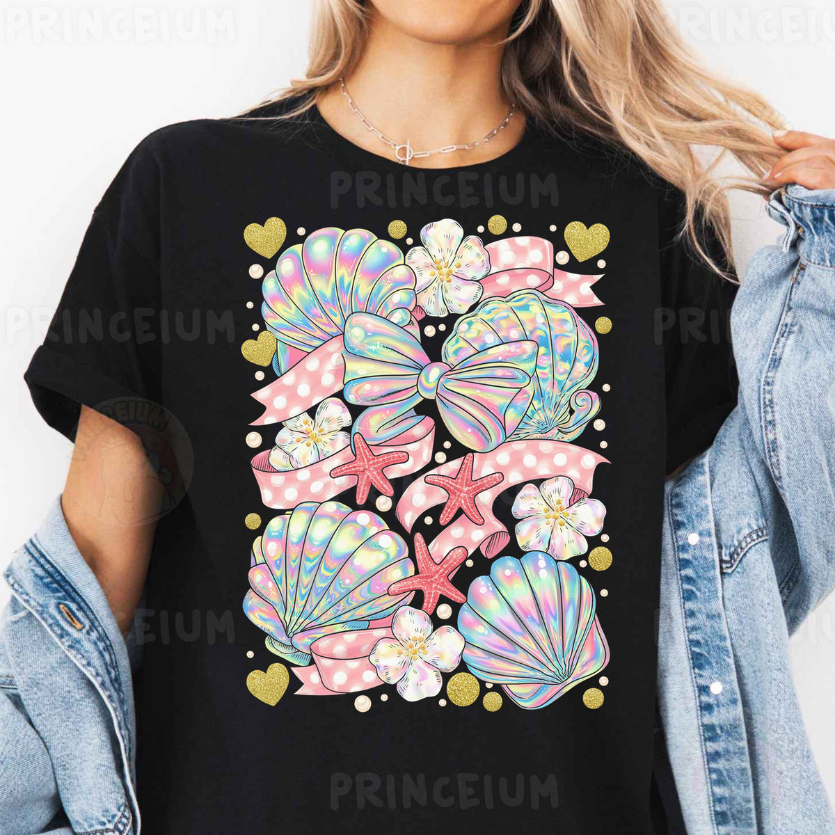 a woman wearing a black t - shirt with colorful seashells on it