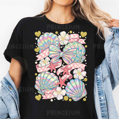 a woman wearing a black t - shirt with colorful seashells on it